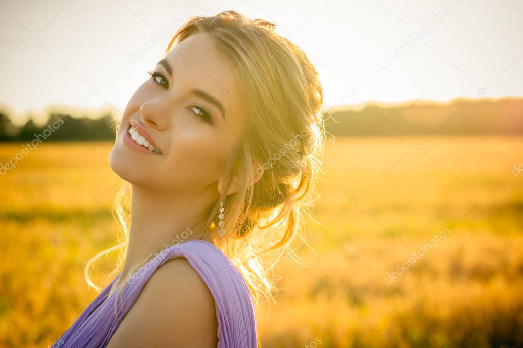 portrait beautiful smiling girl on sunset 