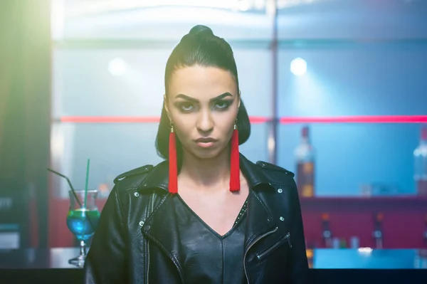 portrait of attractive woman in nightclub bar