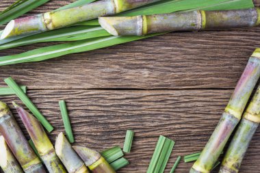 Close up sugarcane on wood background close up clipart