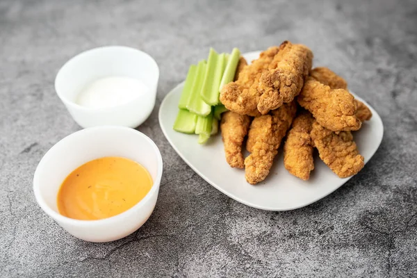 Chicken Fingers dinner, breaded tenders with sauce