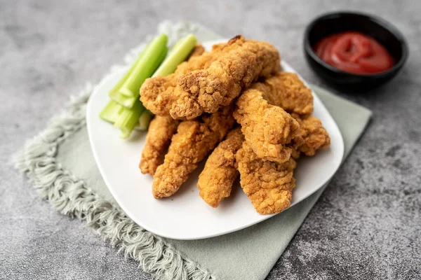 Chicken Fingers dinner, breaded tenders with sauce