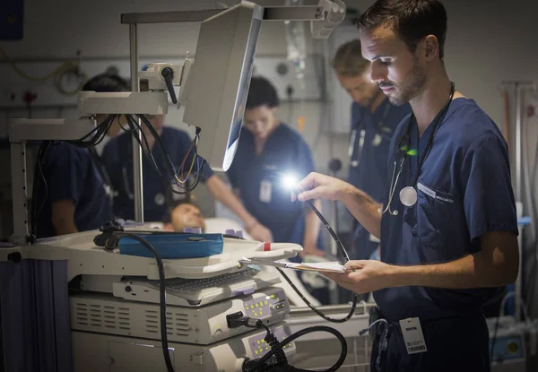 Group Doctors Caring Patient Hospital Ward — Stock Photo, Image