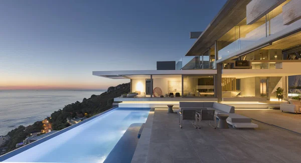 Illuminated Modern Luxury Home Showcase Exterior Patio Lap Pool Ocean — Stock Photo, Image