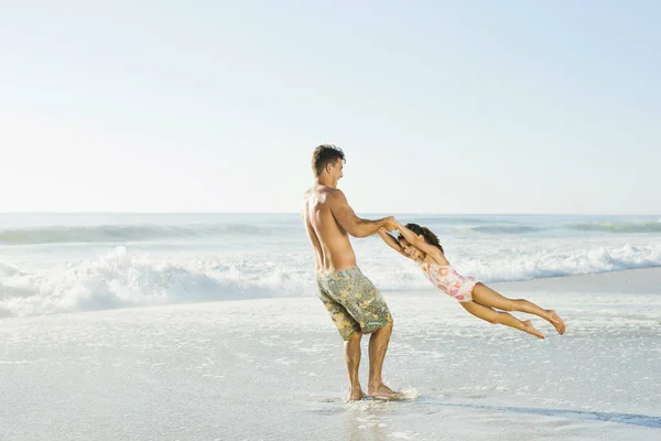 Father Swinging Daughter Surf Beach — Stock Photo, Image