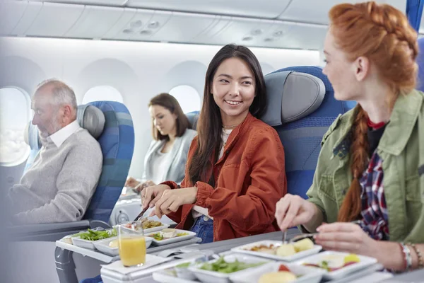 Women Friends Eating Dinner Talking Airplane — Stock Photo, Image