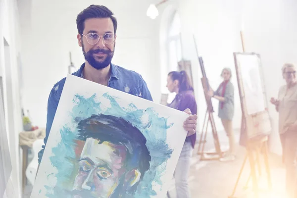 Portrait Smiling Confident Proud Male Artist Holding Painting Art Class — Stock Photo, Image