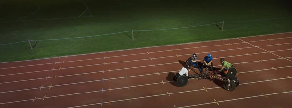 Paraplegic Athletes Huddling Sports Track Training Wheelchair Race Night — Stock Photo, Image