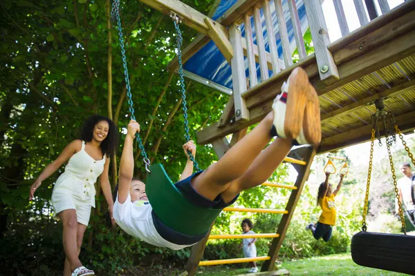 Happy Family Swinging Playing Playground Set Summer Yard — Stock Photo, Image