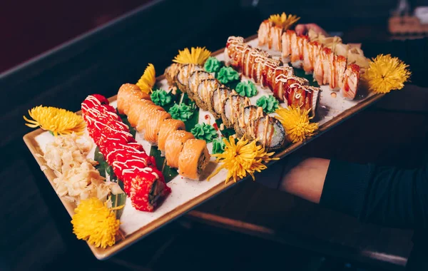 Close Hand Waiter Holding Set Delicious Fresh Sushi Slate Plate — Stock Photo, Image