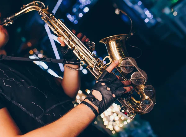 Boys Band saxophone section at event , jazz player male playing on Saxophone, music instrument played by man saxophonist  musician at  folk classical . Alto sax hands Closeup banner