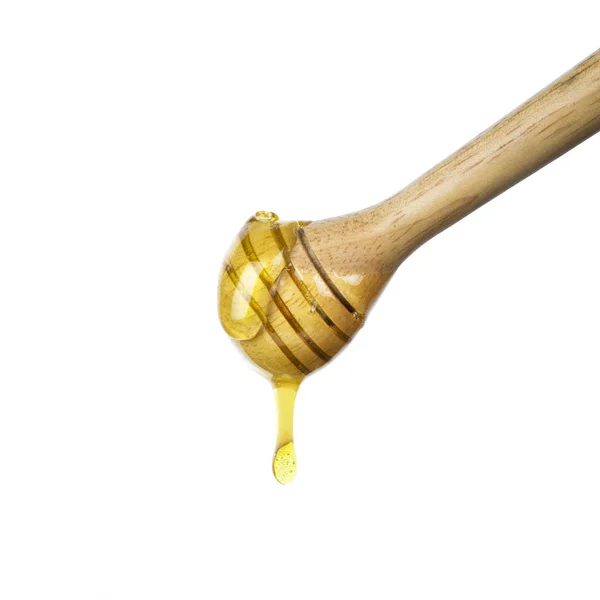 Beyaz arka planda bal damlaması izole edildi