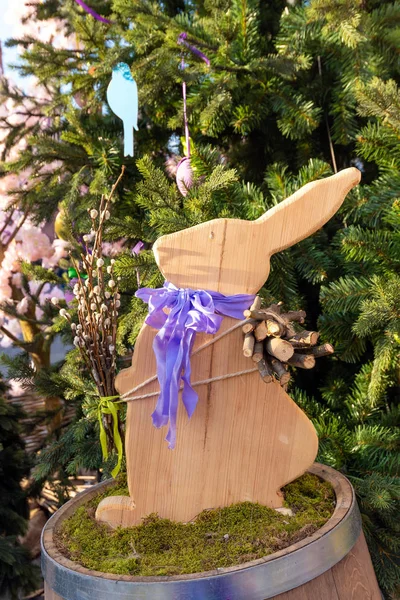 Cute wood rabbit and easter eggs hanging on tree decorate  during the season of Eastertide.