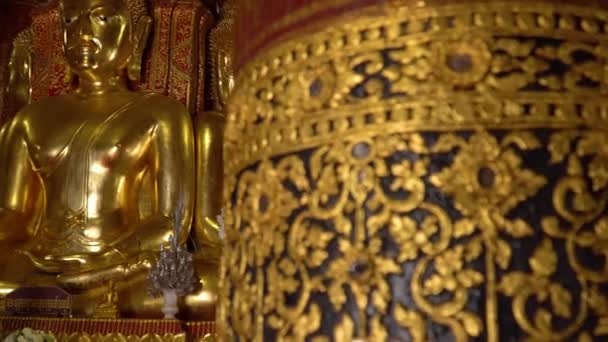 Ancient Large Gilded Buddhas Seated Raised Platform Wat Phumin Temple — Stock Video