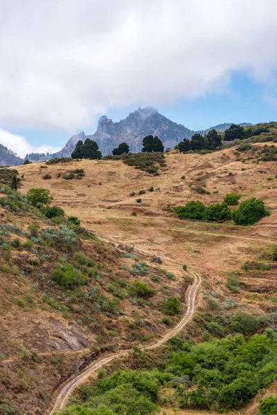 Path through the mountains of Gran Canaria, mountain peak in the background