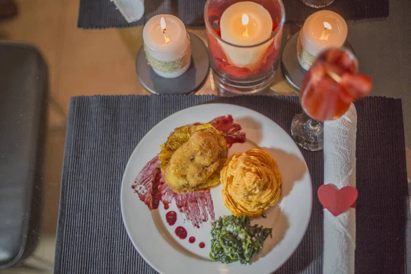 Valentines day. dinner scene and love. meal and decorative candles