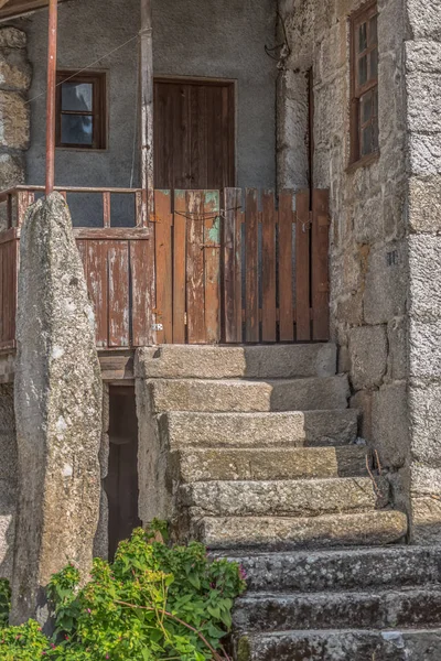 View of old and rustic house, with outside staircase in the entrance, typical rural architecture of the north of Portugal