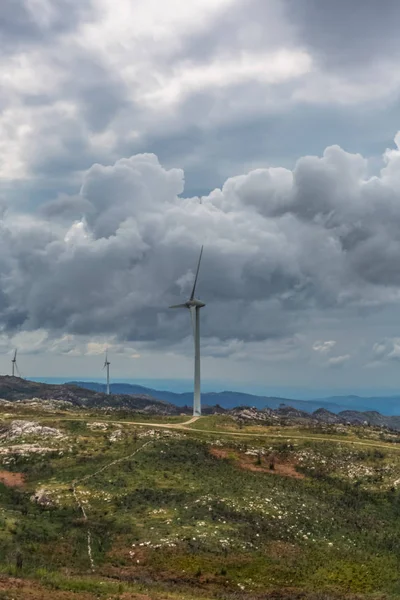 View of a wind turbines on top of mountains — Stock Photo, Image