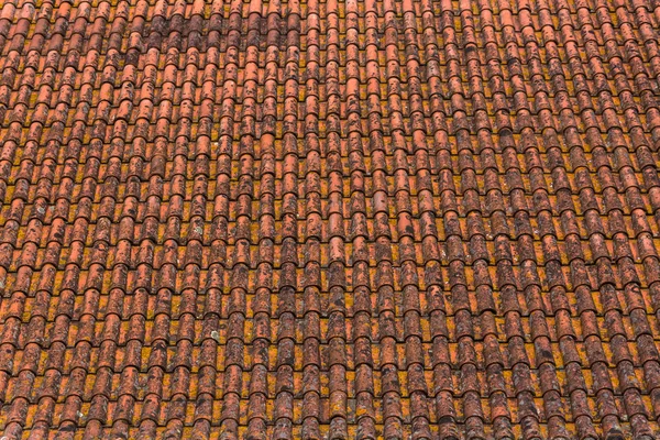 Old and rusty ceramic orange roof tiles texture — Stock Photo, Image