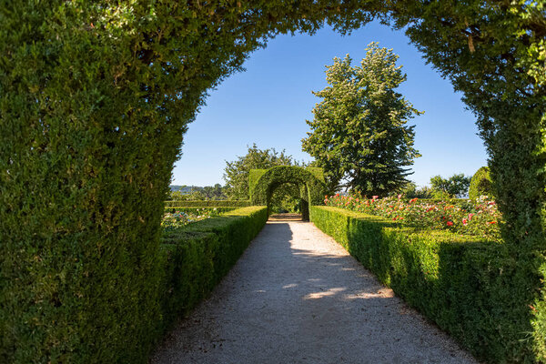 View of a pedestrian path on iconic and geometric classic baroque garden, located inside the Villa de Mateus in Vila Real