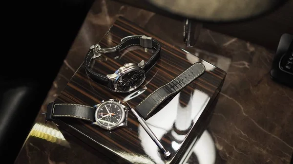 Closeup of luxury watches and tools.