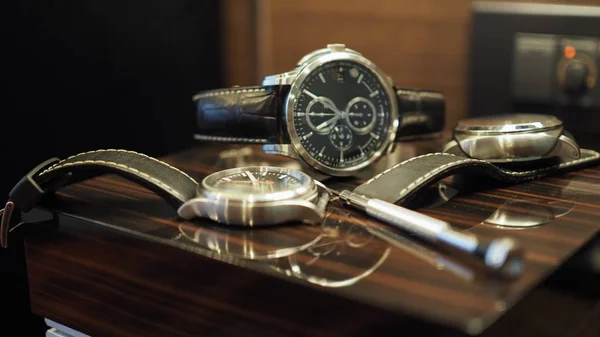 Closeup of luxury watches and tools.