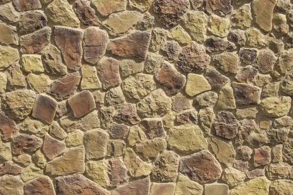 Çatlamış bir taştan bir duvar parçası.