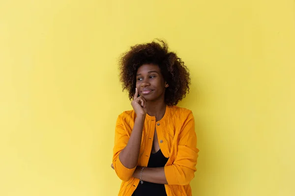 the beautiful and happy African American on a yellow background