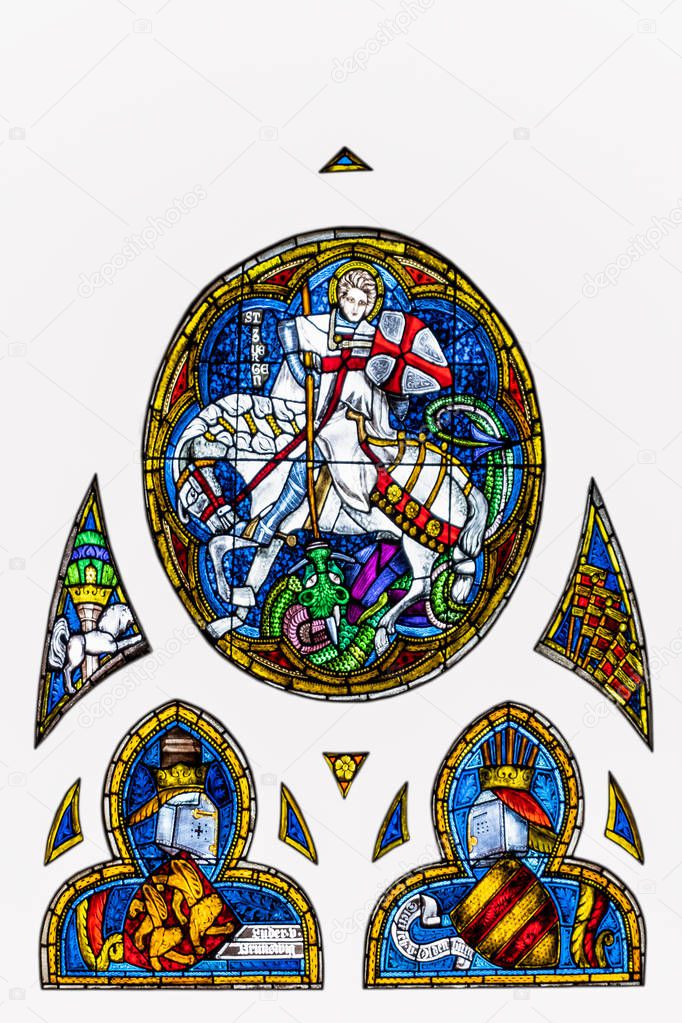 Medieval stained glass depicting St. George killing the dragon i