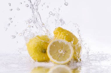yellow lemons with water splash