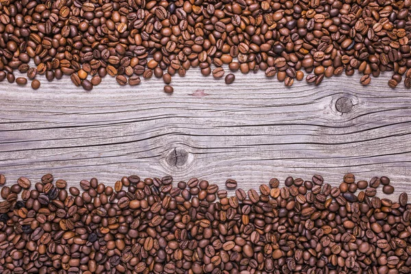 roasted coffee beans on vintage wooden background