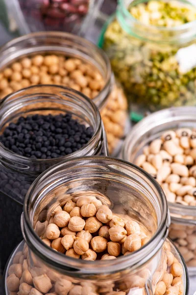 Variety Dried Legumes Glass Jars Selective Focus Jar Foreground Chickpeas — Stock Photo, Image