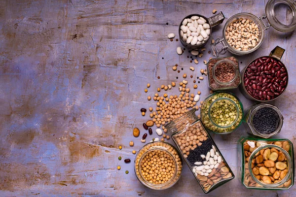 Large Variety Dried Legumes Glass Jars Background Texture Top View — Stock Photo, Image