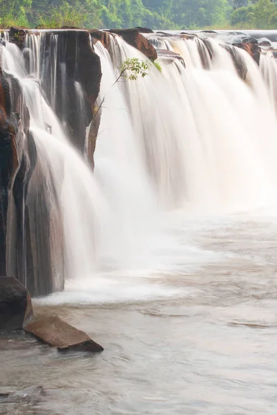 Beautiful tropical waterfall on summer morning.