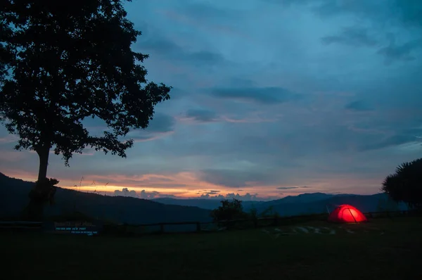 Illuminated camping tent at twilight. — Stockfoto