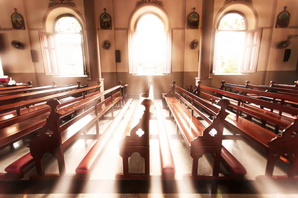 Tranquil ancient church interior at sunrise, Santa Cruz Church or Kudi Chin, Bangkok, Thailand. The church is open to the public. High-key lighting. Defocus.