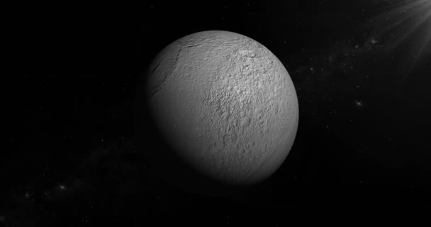 Téthys, la lune de Saturne, tourne sur sa propre orbite dans l'espace. Boucle 