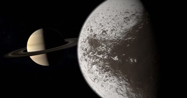 Satellite Iapetus tournant et orbitant autour de la planète Saturne 