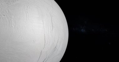 Enceladus uydusu, Satürn 'ün uydusu, uzayda dönüyor. Bu görüntünün elementleri NASA tarafından döşenmiştir