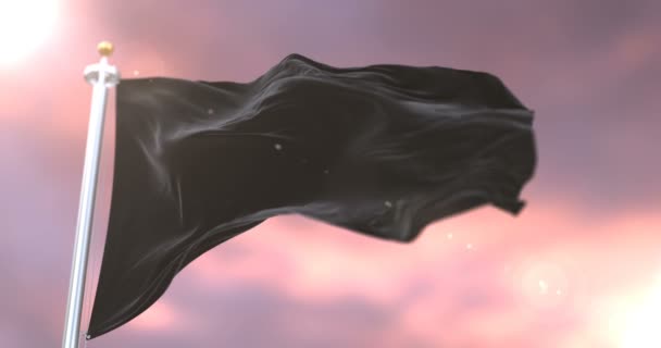 Yavaş Günbatımı Döngü Içinde Siyah Bayrak Sallayarak Rüzgar — Stok video