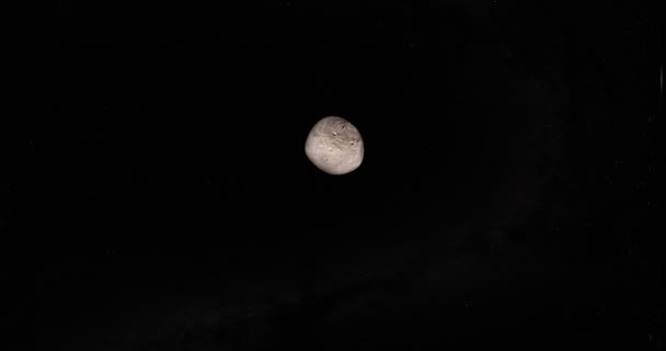 Un astéroïde de Pallas orbitant dans l'espace vers la caméra 