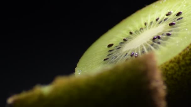 Kiwi Fruit Sliced Half Spinning Black Background — 비디오