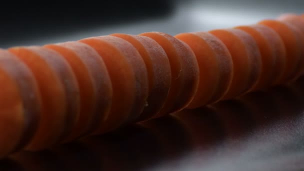 Raw Carrot Cut Gyrating Black Tray Black Background Daucus Carota — Stockvideo