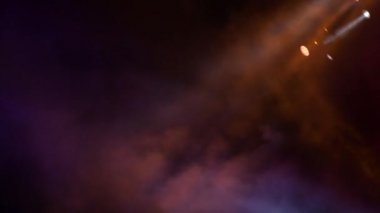 Stage lights in a concert with smoke fog moving