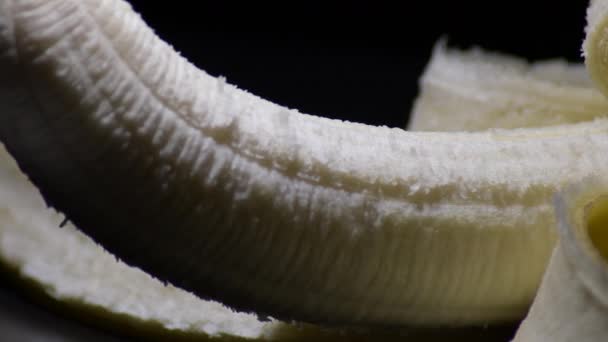 Giro Frutas Banana Com Luz Íntima Fundo Preto — Vídeo de Stock