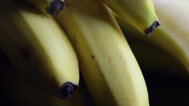 Detail Bananas Bunch Gyrating Black Background — Stock Video