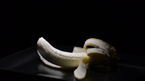 Fresh Banana Fruit Peeled Gyrating Black Background — Stock Video