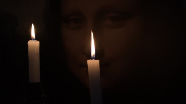 Face Mona Lisa Gioconda Illuminated Candles — Stock Video