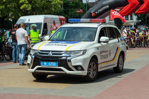 Khmelnitsky, Ukraine - June 3, 2018. The car of the new police escorting the convoy on a bicycle day holiday