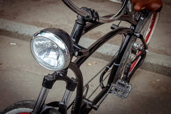 headlight  on the frame of the bike.