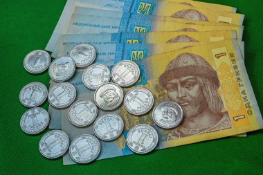 New and old coin One hryvnia in Ukraine clipart